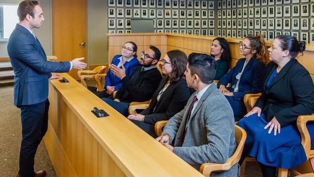 Student presents to a jury in moot court.